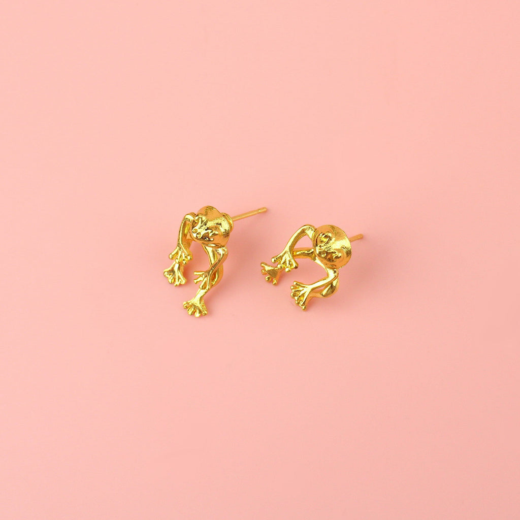 2 piece frog earrings - front piece includes the head and arms and the back piece includes the legs - made out of gold plated base metal