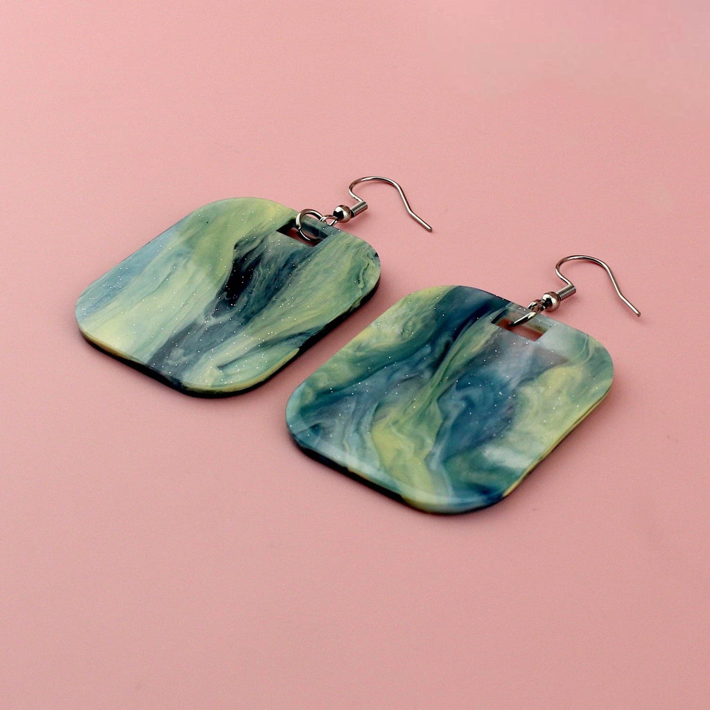 Blue sparkling glittery marble resin charms on stainless steel earwires