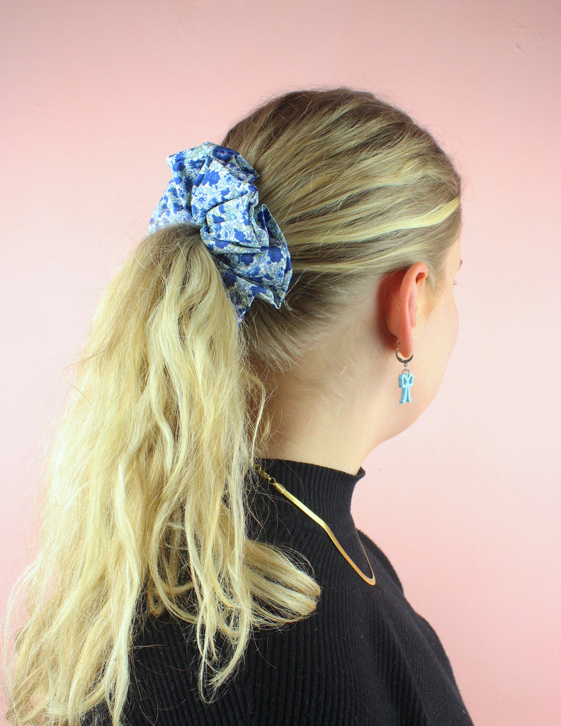 Model wearing blue floral scrunchie