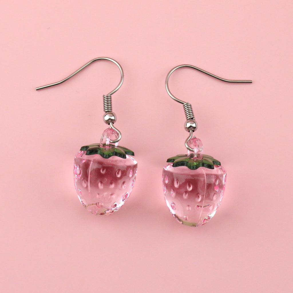 Translucent pink strawberry charm on stainless steel earwires