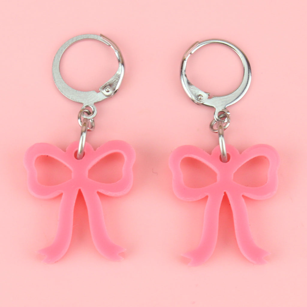 Mini rose pink bow charms on stainless steel huggie hoops