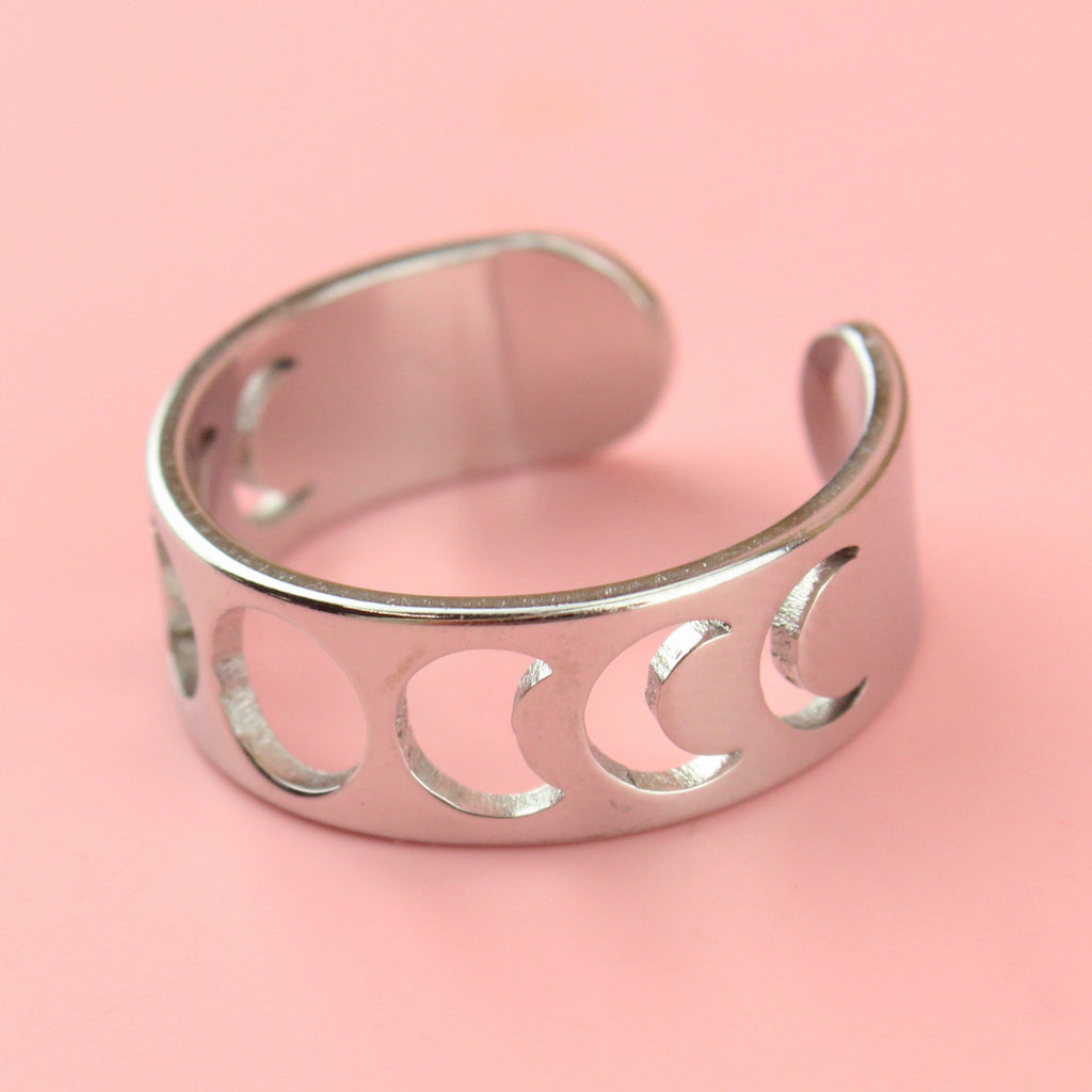 Stainless steel ring with a cut out moon phase design