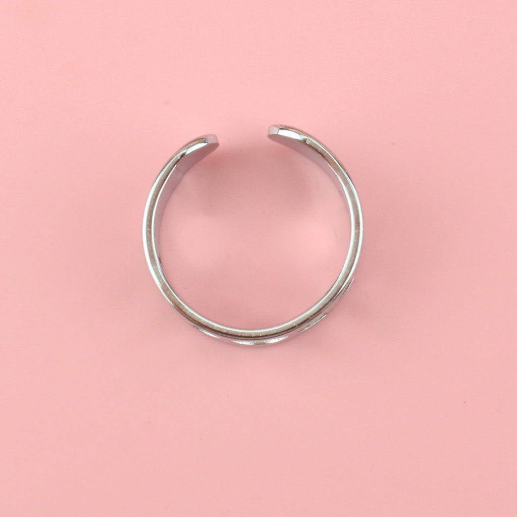 Stainless steel ring with a cut out moon phase design