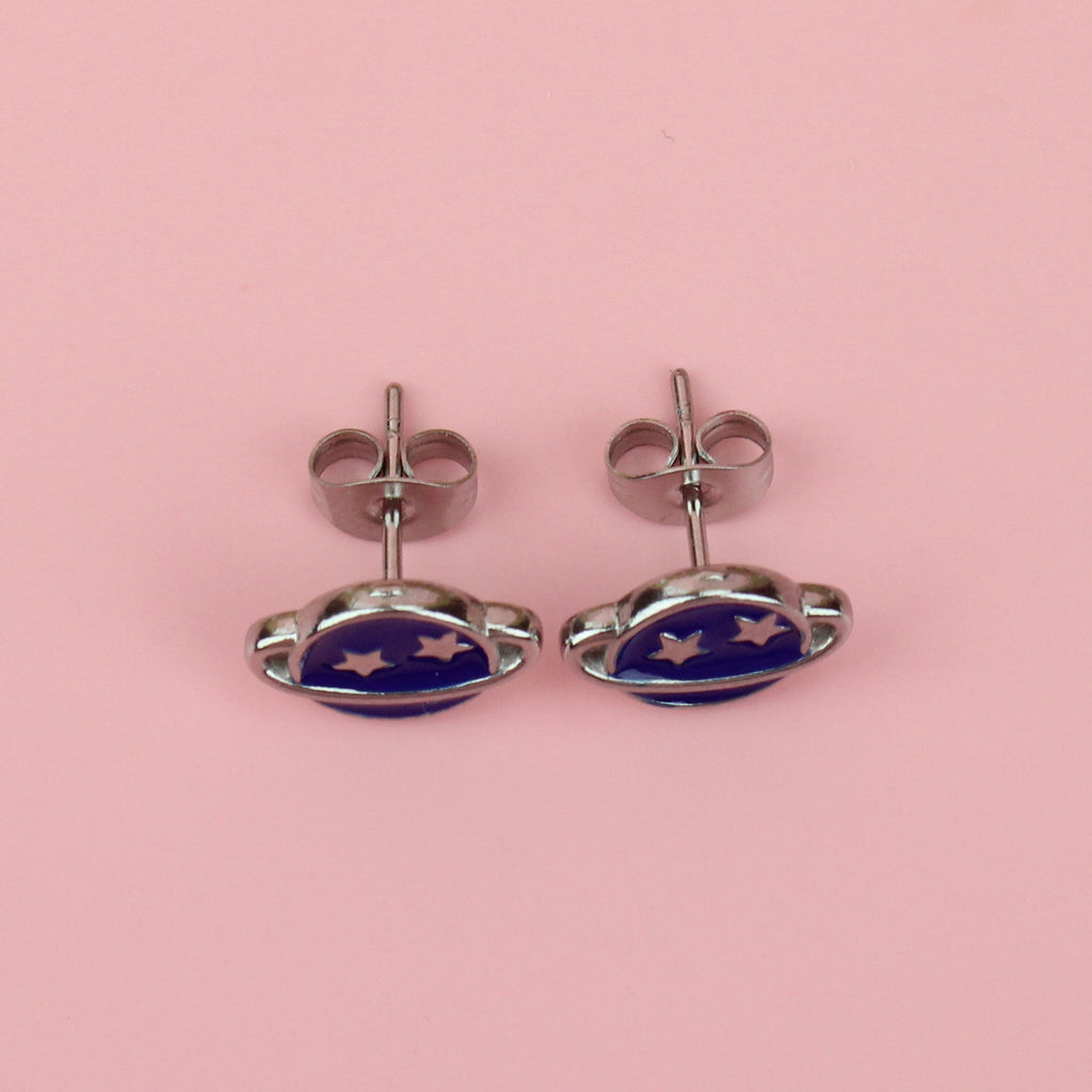 stainless steel neptune planet stud earrings with blue enamel and two stars on the top half of the planet