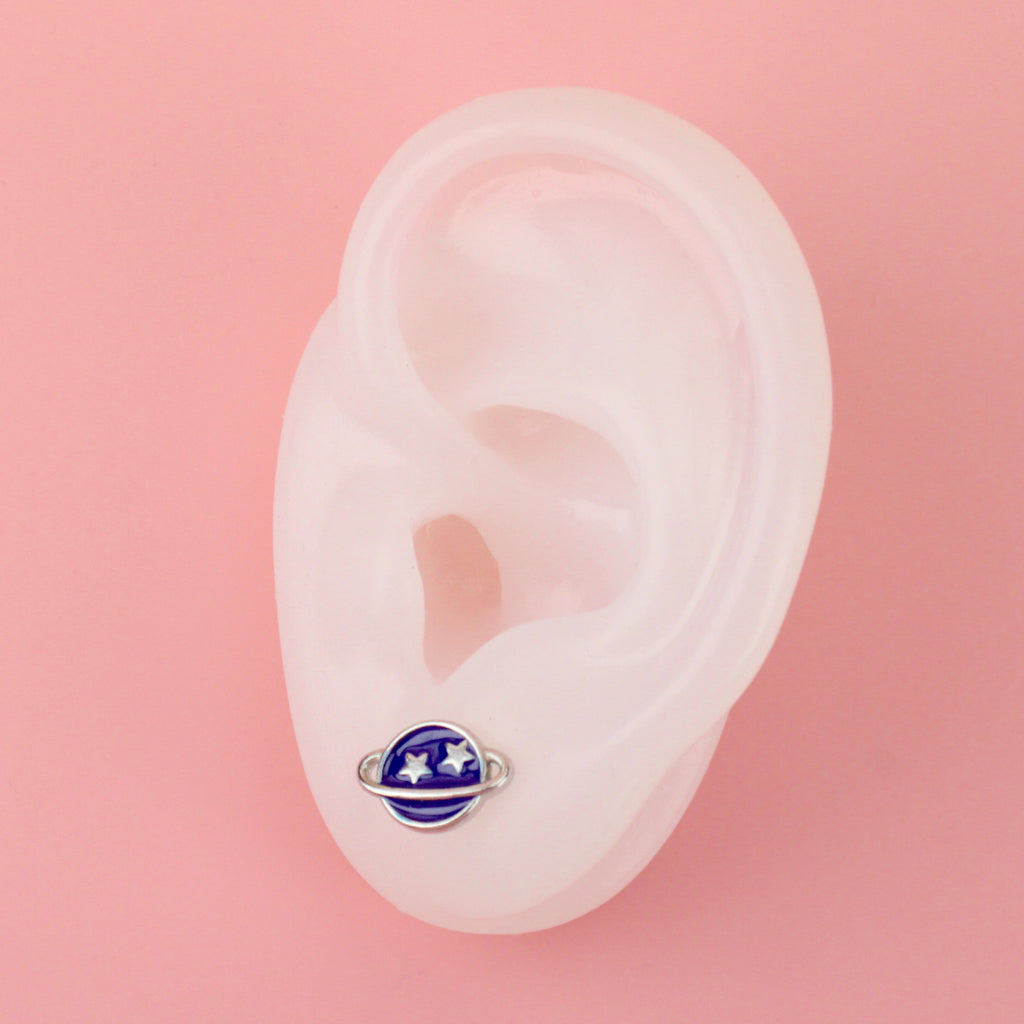 Ear wearing Neptune Stud earrings