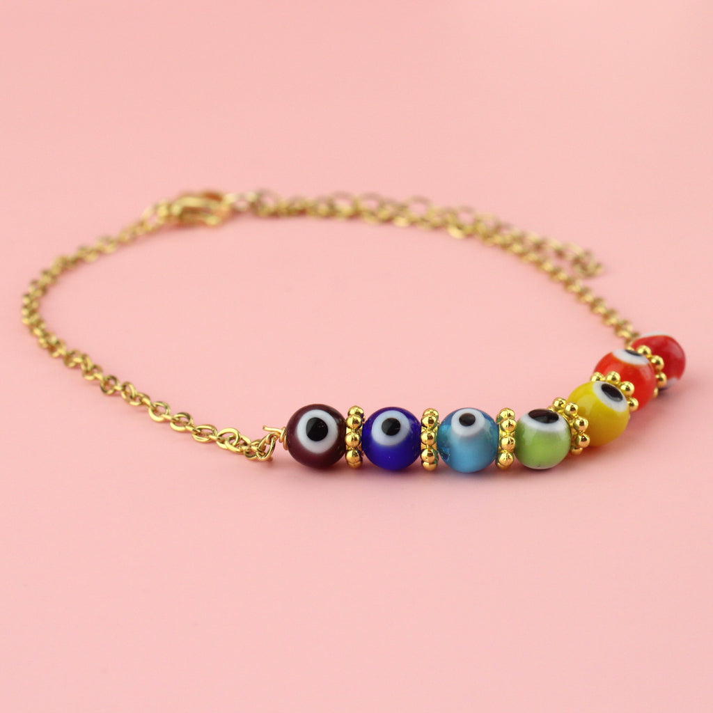 Purple, blue, turquoise green, yellow, orange and red glass beads with an evil eye on each bead on a gold plated stainless steel anklet