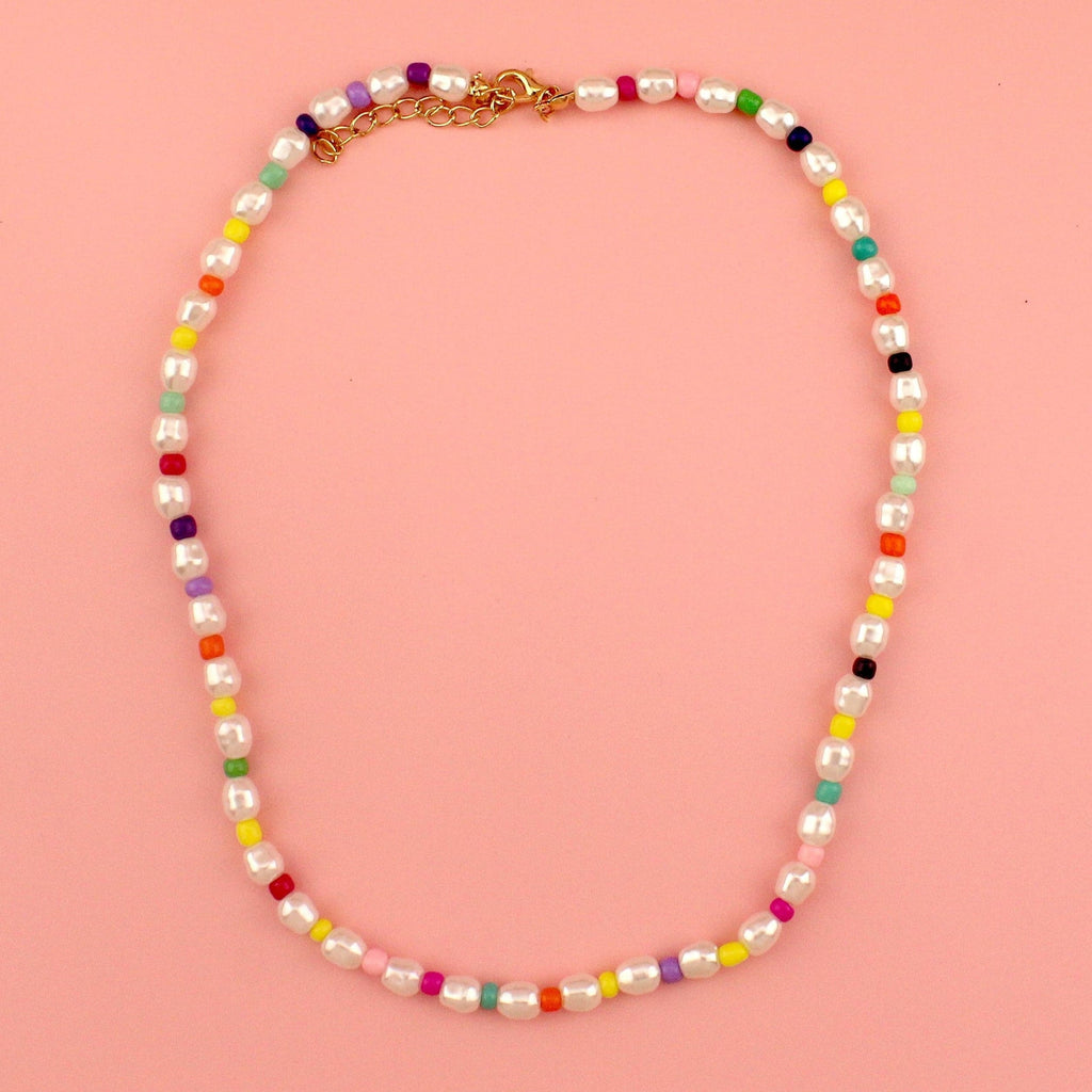 Plastic pearl necklace with pink, green, yellow, blue, purple and orange beads