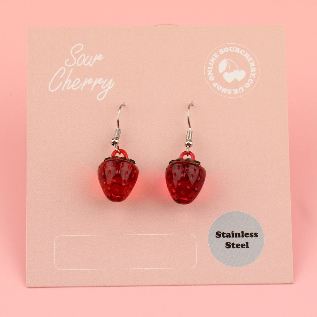 Red clear strawberry charms on stainless steel earwires shown on the card