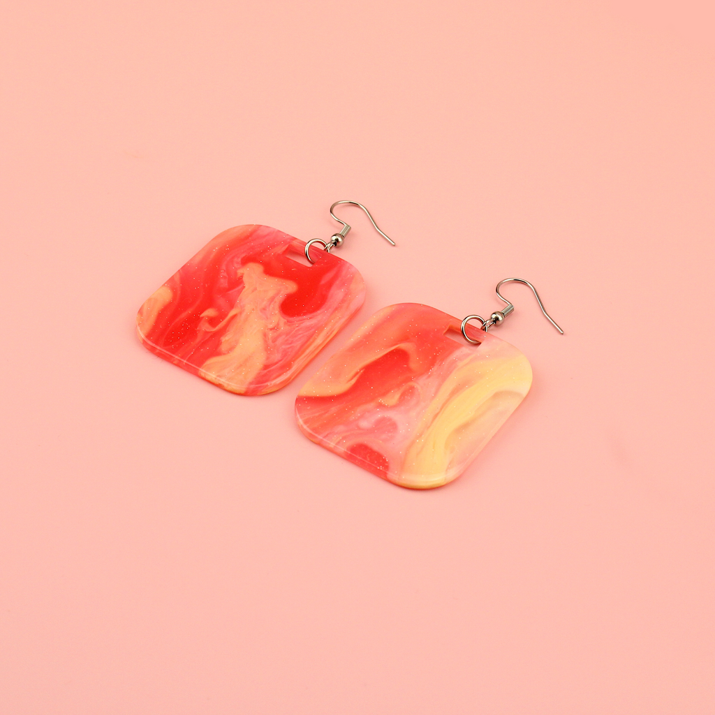 Red sparkling glittery marble resin charms on stainless steel earwires