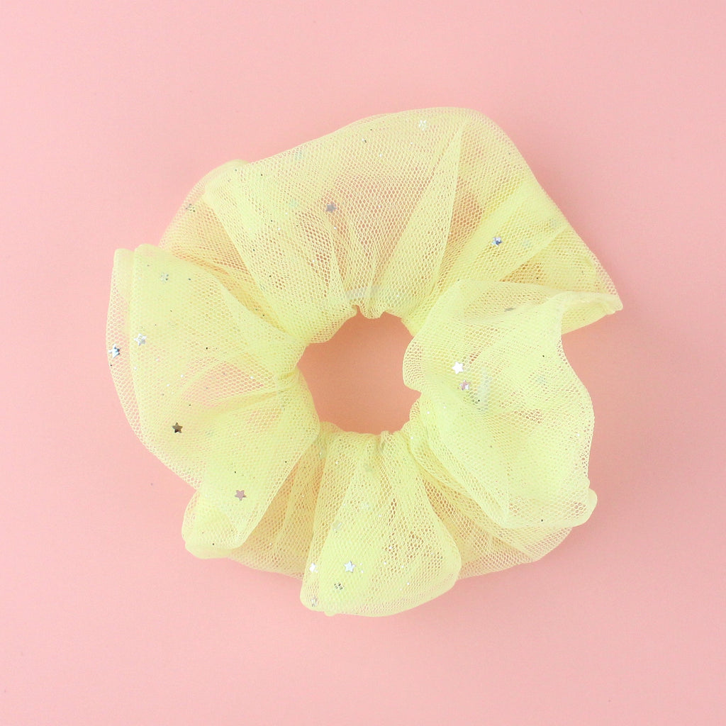 Baby yellow coloured mesh scrunchie with silver stars
