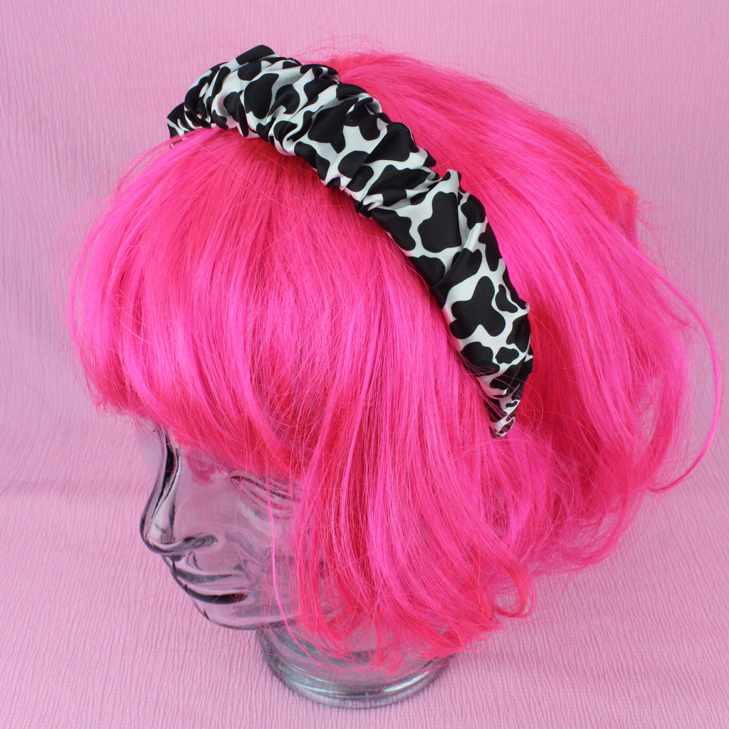 Udderly Adorable Headband shown on a wig for scale
