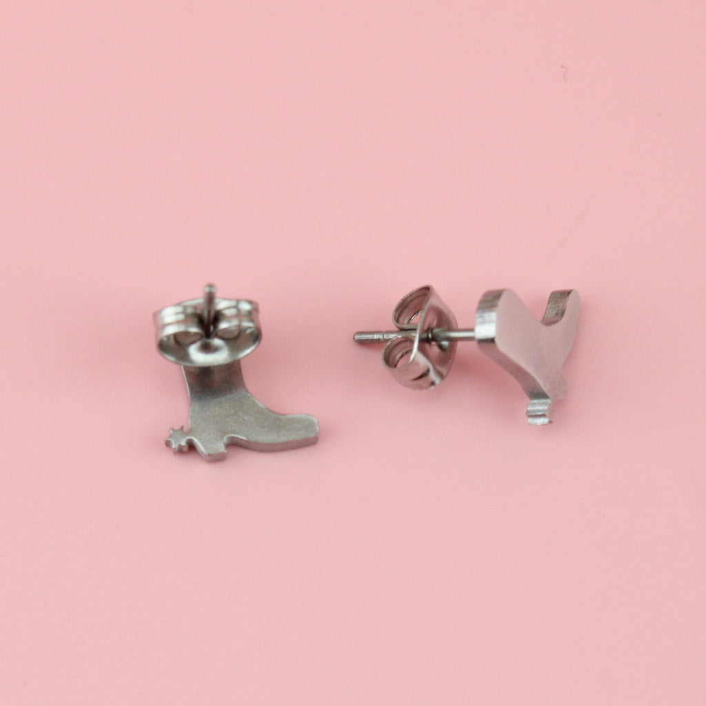 Stainless steel studs in the shape of a cowboy boot with a star at the side of each boot