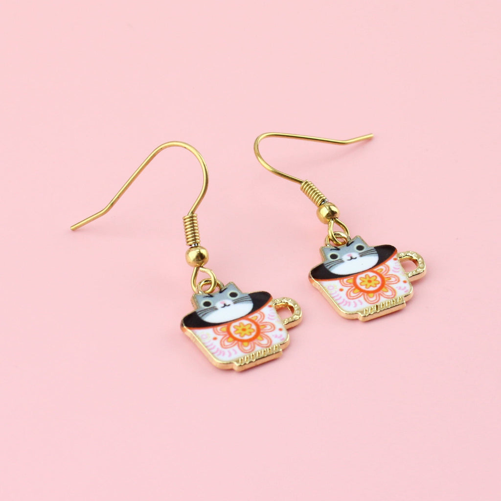 Gold plated stainless steel earwires with charms featuring cats in a teacup