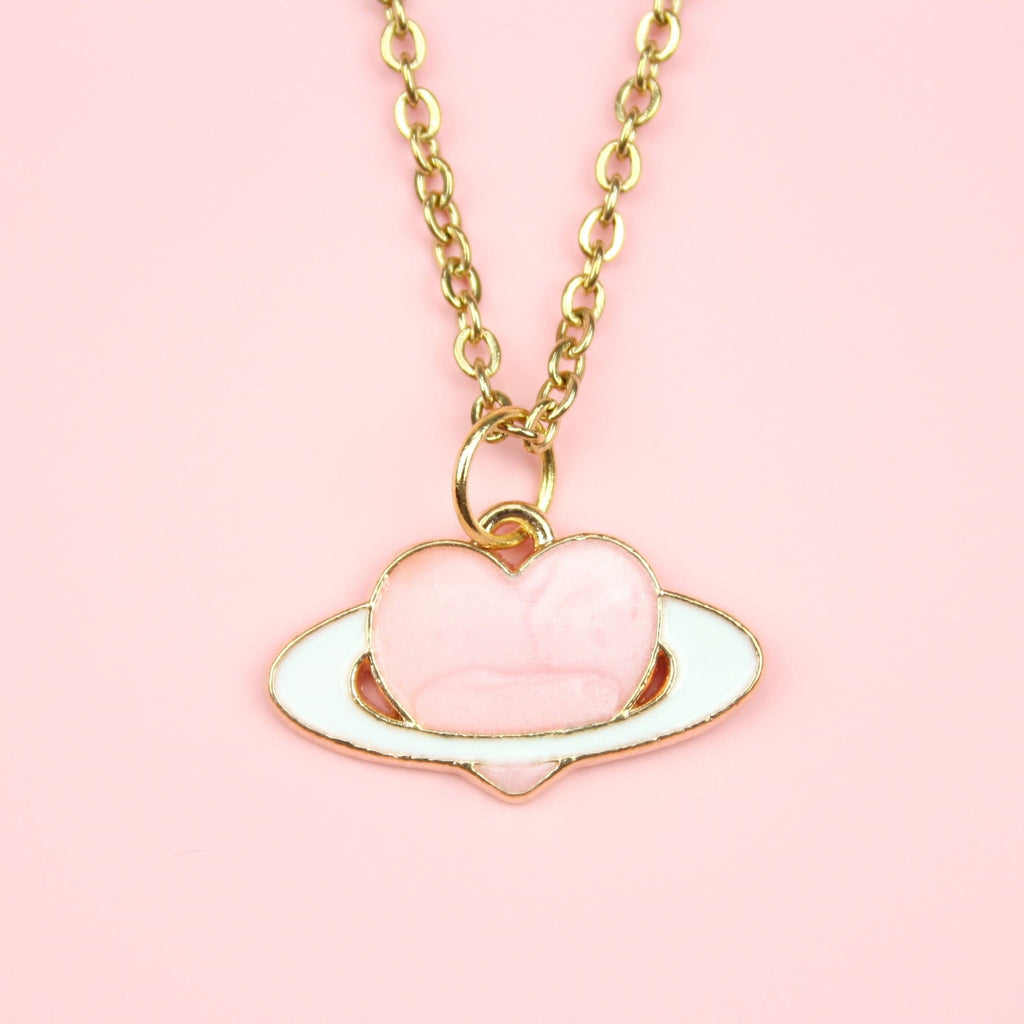 Gold plated & enamel pink heart planet charm on a Gold Plated Stainless Steel chain