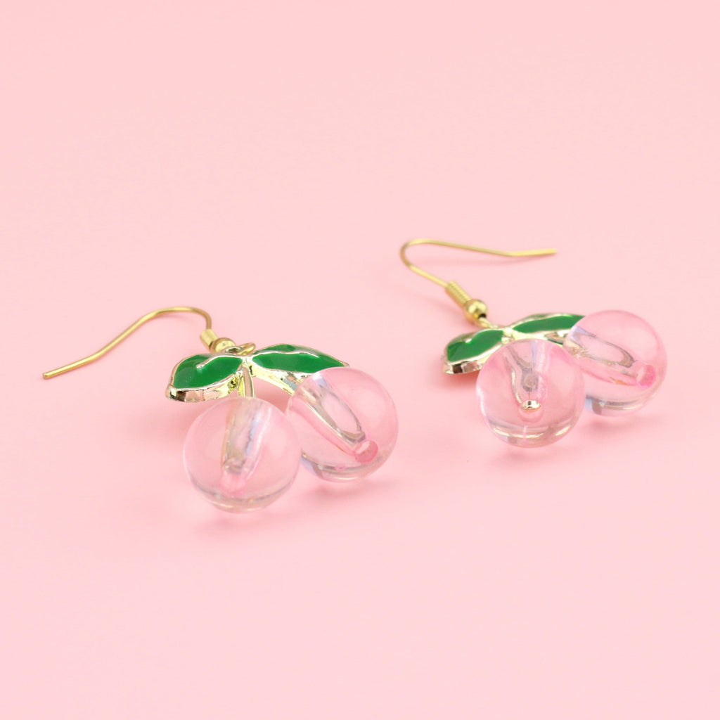 Gold plated metal green leaves with pink plastic cherry charms on gold plated stainless steel earwires