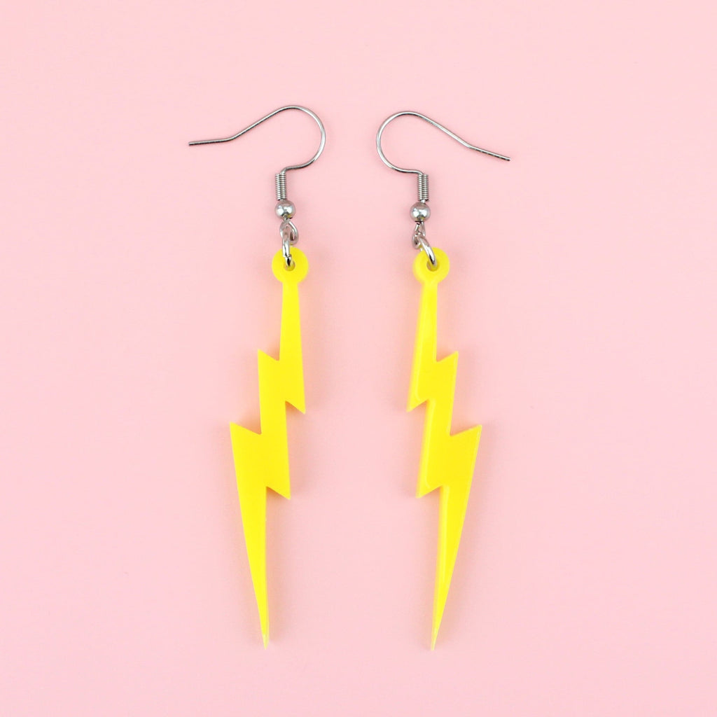 Laser cut yellow perspex lightning bolt charms on stainless steel earwires