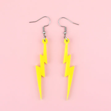 Laser cut yellow perspex lightning bolt charms on stainless steel earwires