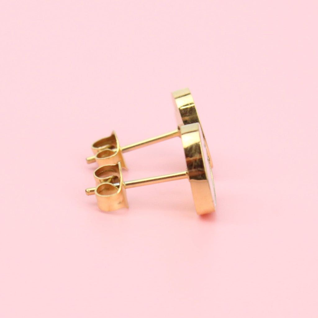 Gold plated stainless steel studs with gold outline and shell inlay with backs