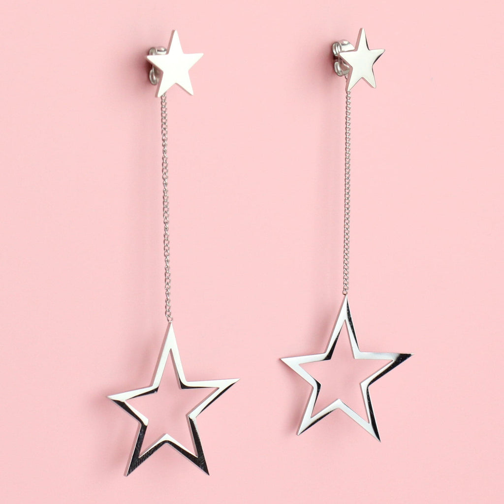 Cut out stars suspended from a dangly chain and star studs