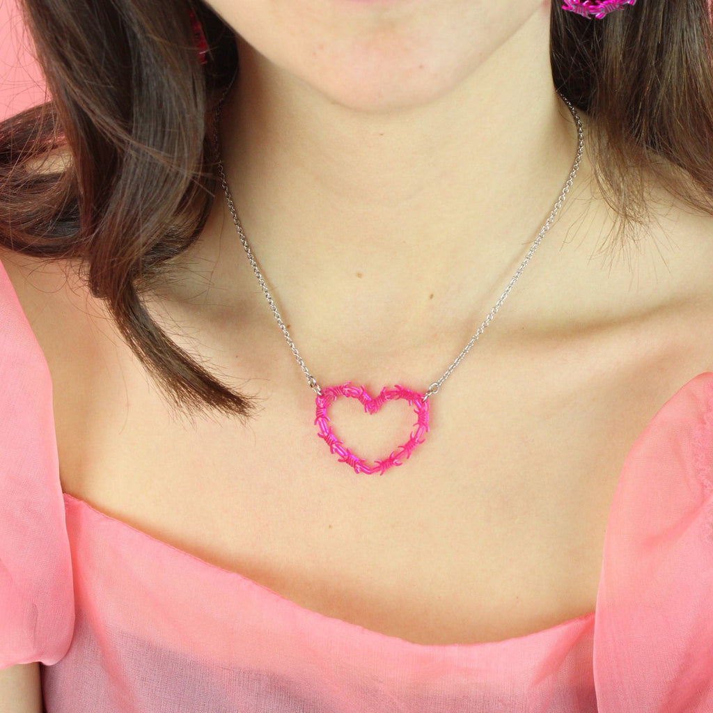 Model wears Pink Barbed Wire Heart Necklace