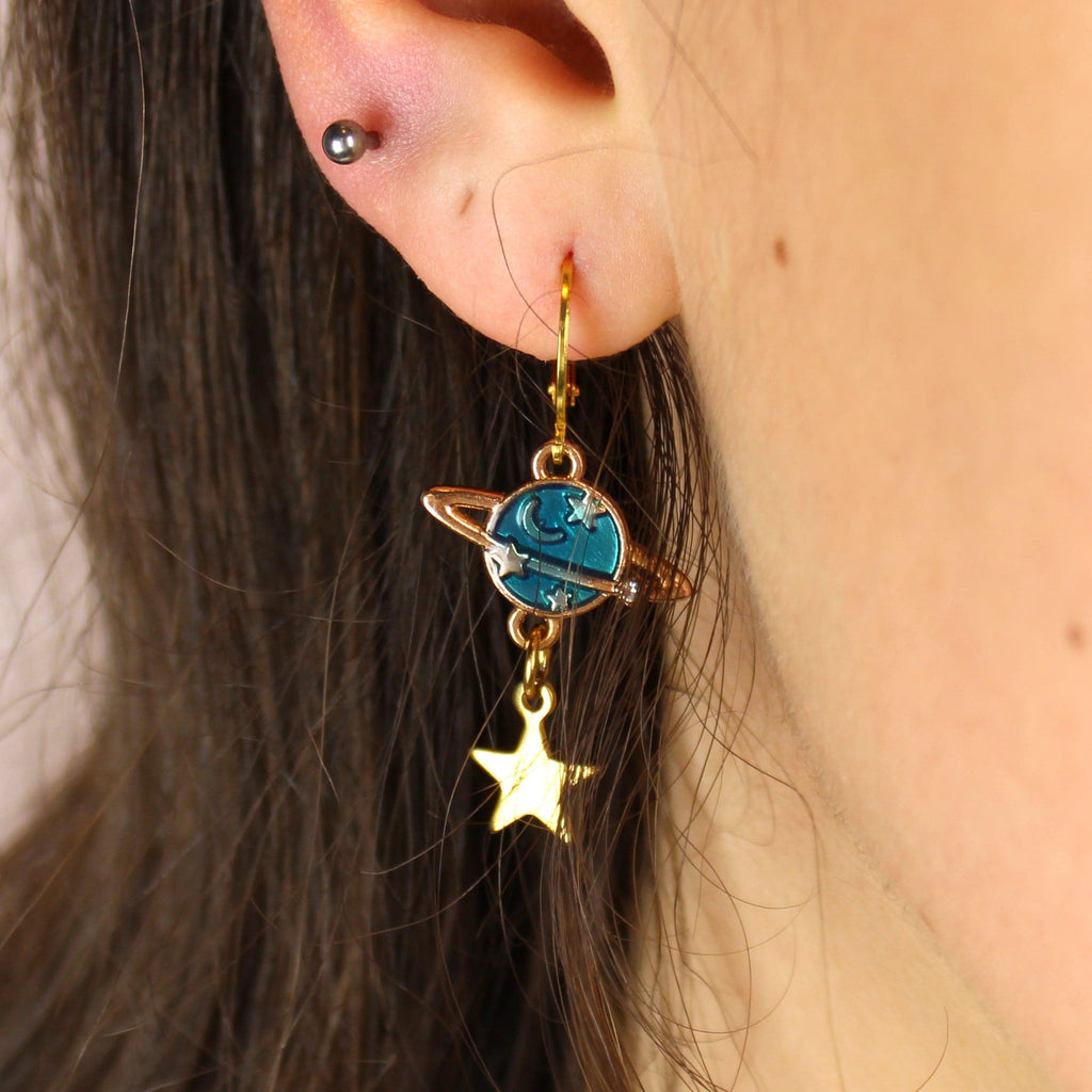 Gold plated stainless steel hoops with blue planet and star charms