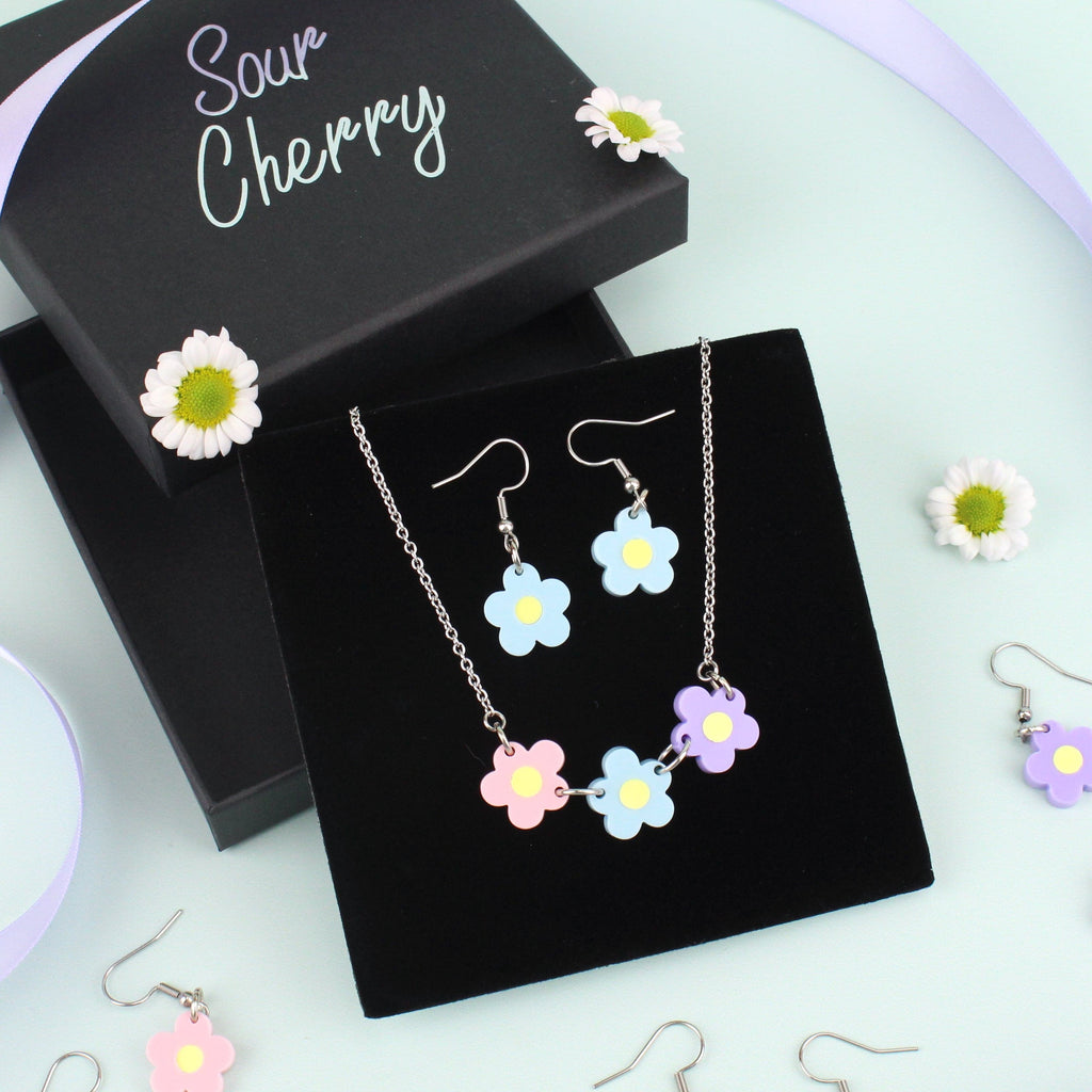 Blooming Botanicals Necklace and matching blue flower earrings shown in gift box