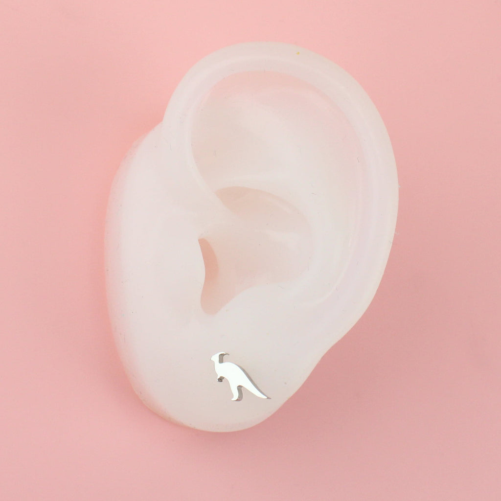 Ear wearing Parasaurolophus shaped stainless steel stud earrings