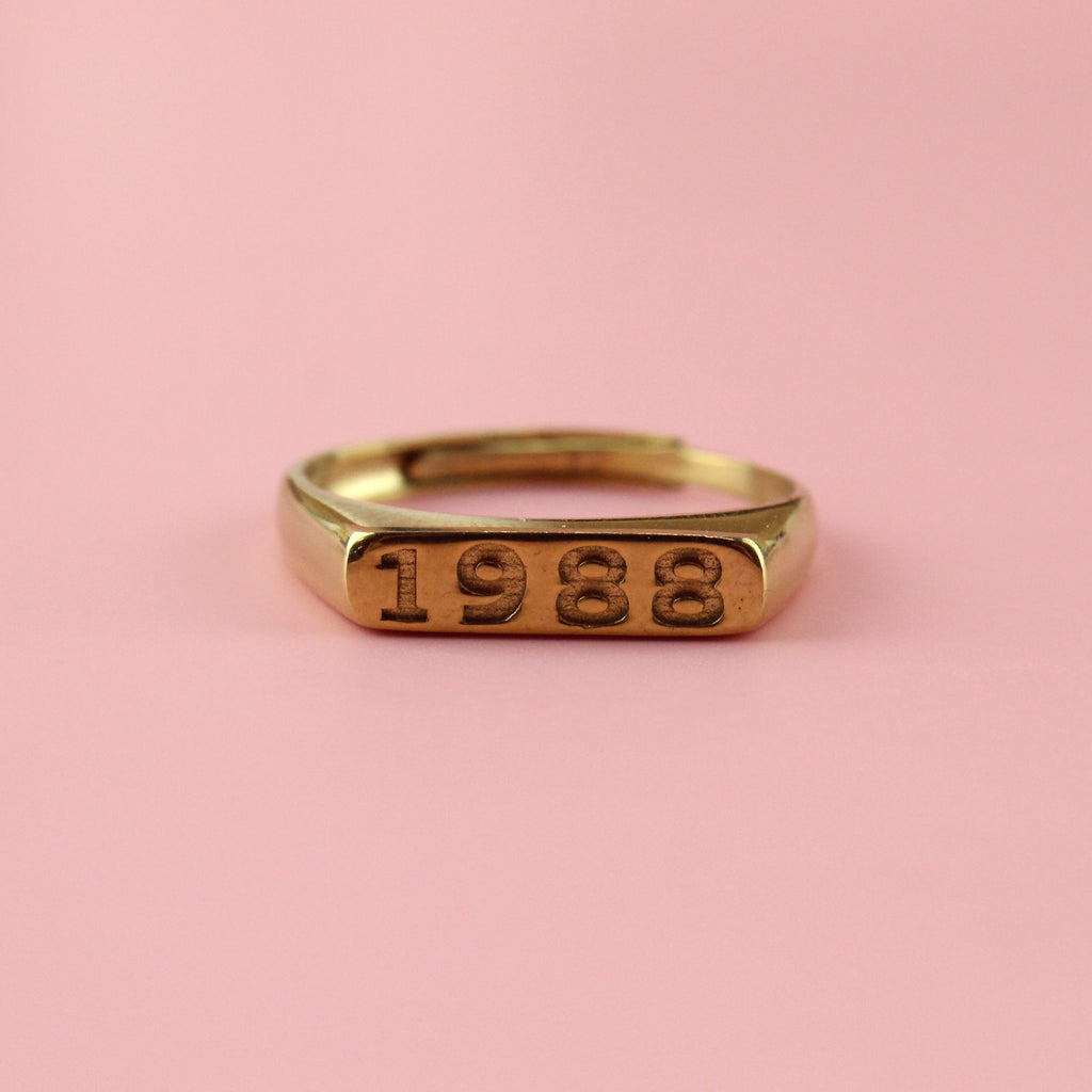 Gold plated stainless steel ring with 1988 engraved on the front