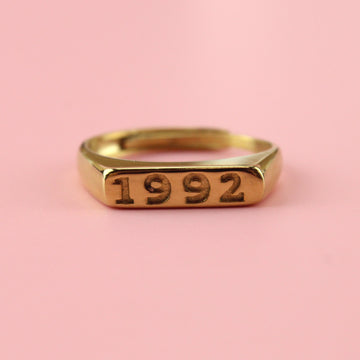 Gold plated stainless steel ring with 1992 engraved on the front