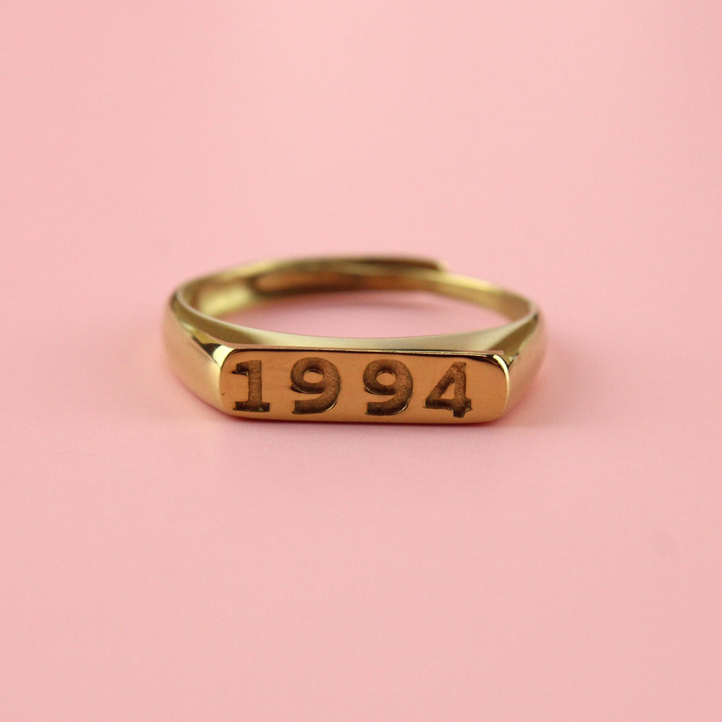 Gold plated stainless steel ring with 1994 engraved on the front