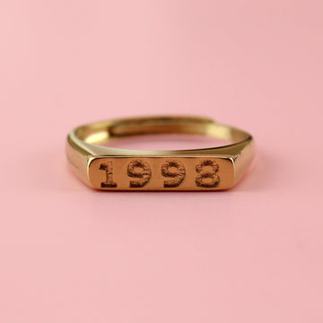 Gold plated stainless steel ring with 1998 engraved on the front