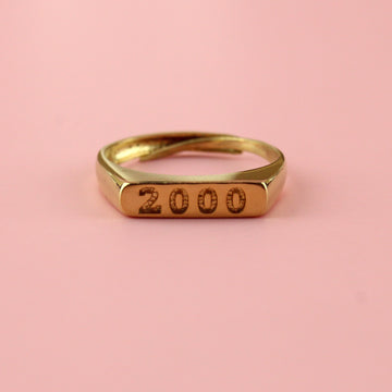 Gold plated stainless steel ring with 2000 engraved on the front