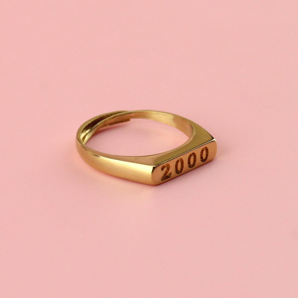 Gold plated stainless steel ring with 2000 engraved on the front