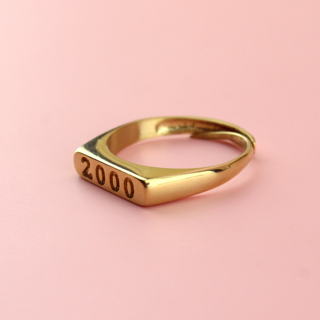 Gold plated stainless steel ring with 2000 engraved on the front