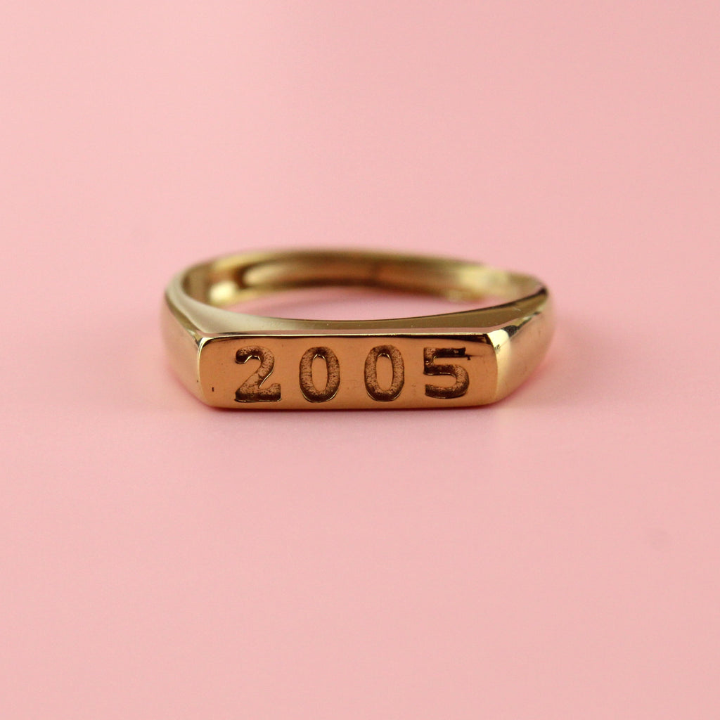 Gold plated stainless steel ring with 2005 engraved  on the front
