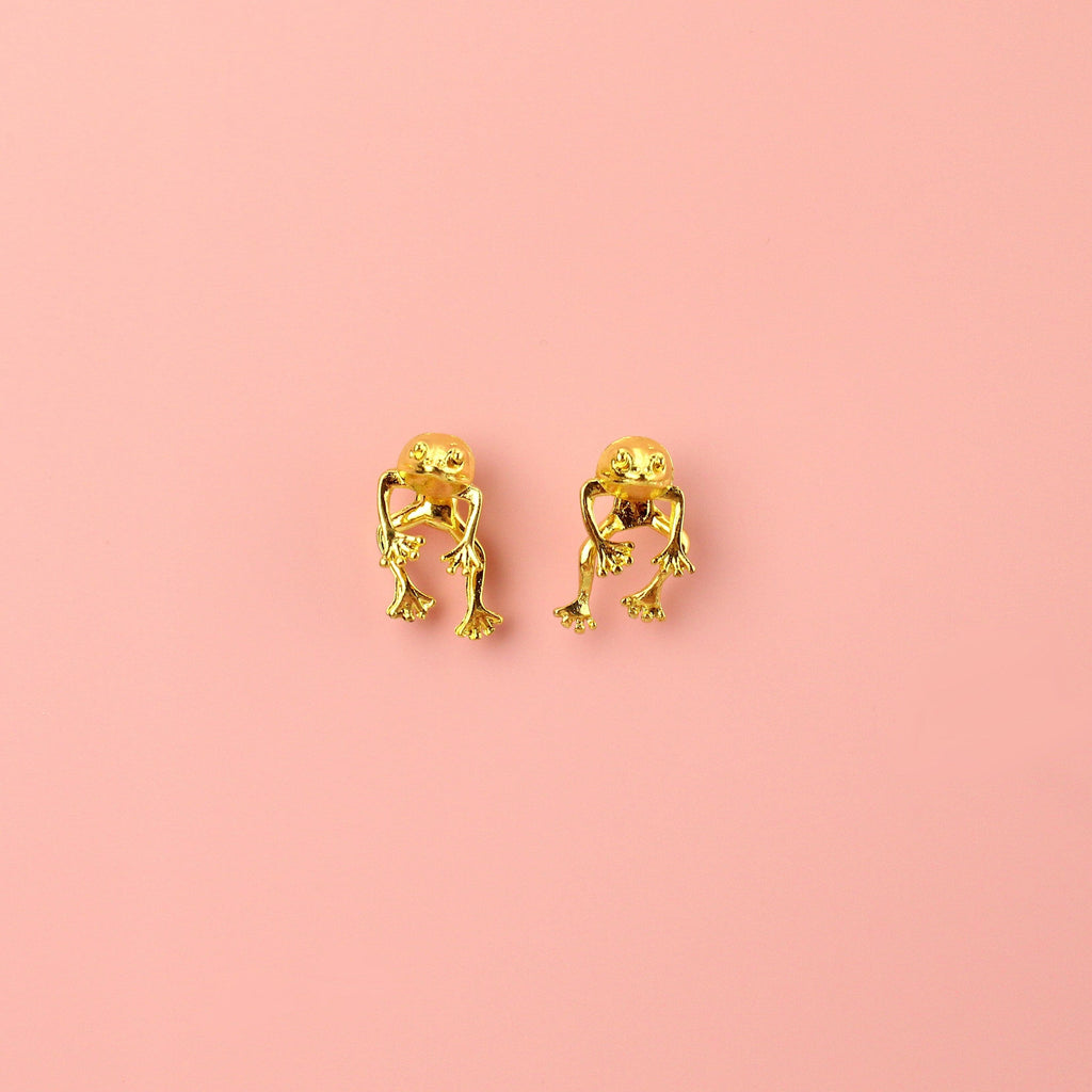 2 piece frog earrings - front piece includes the head and arms and the back piece includes the legs - made out of gold plated base metal