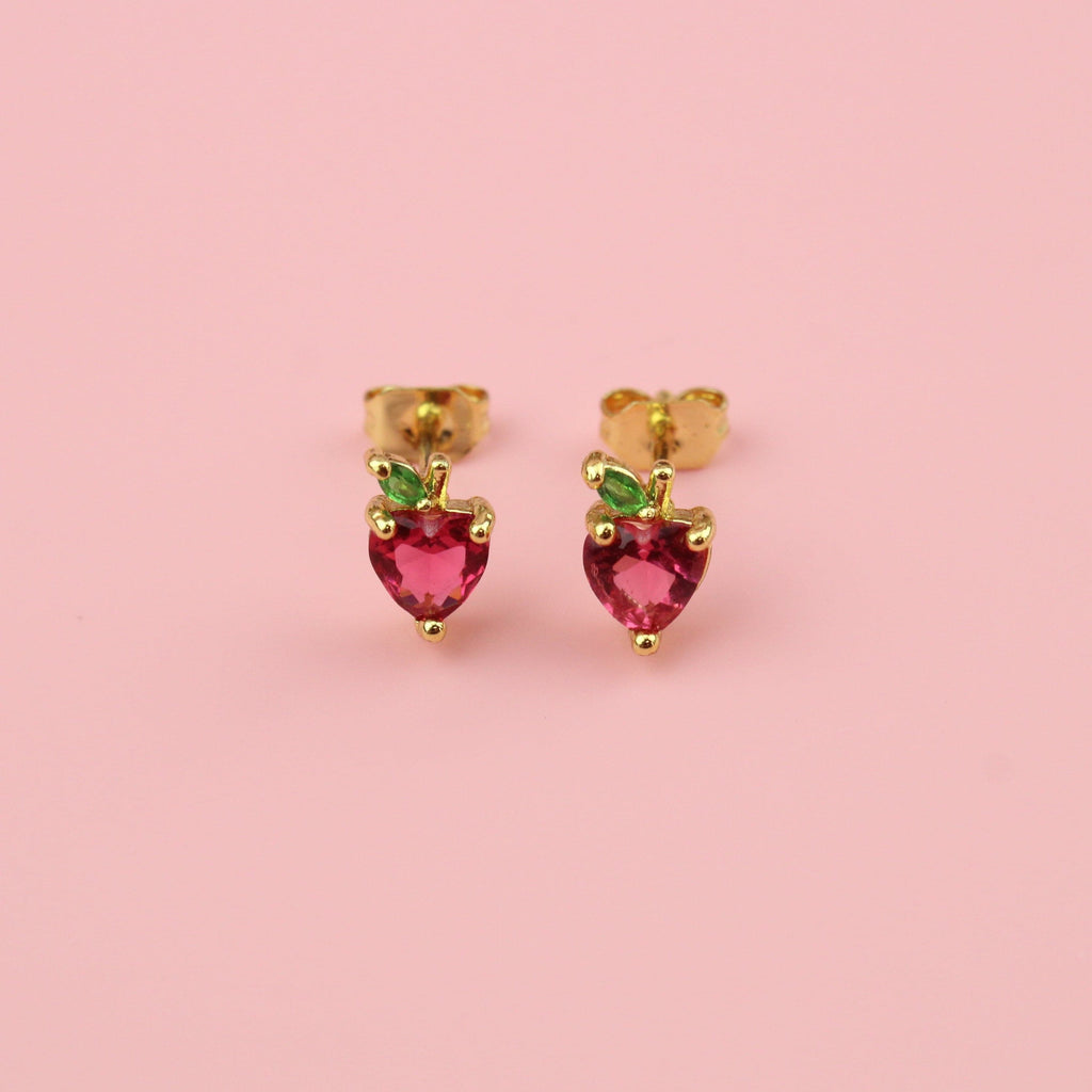 Apple shaped studs with red and green cubic zirconia and gold balls around the apple on gold plated base metal studs