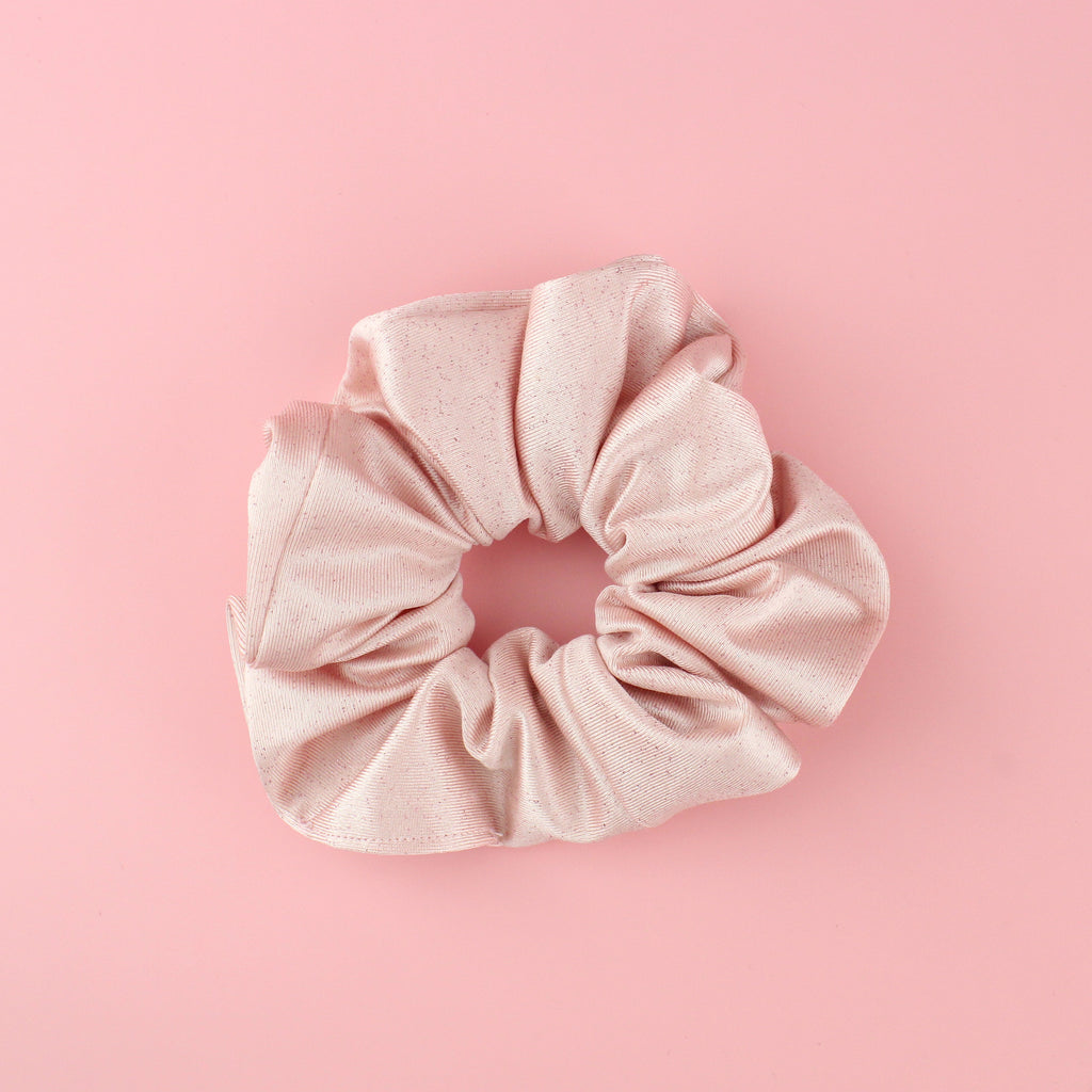 Baby pink satin-like material scrunchie with pink glitter