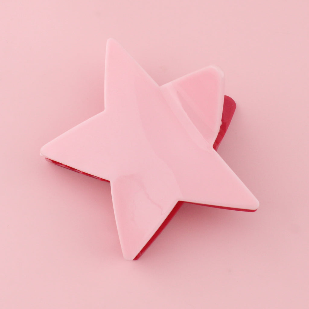 Double sided star claw clip with a light and dark pink side