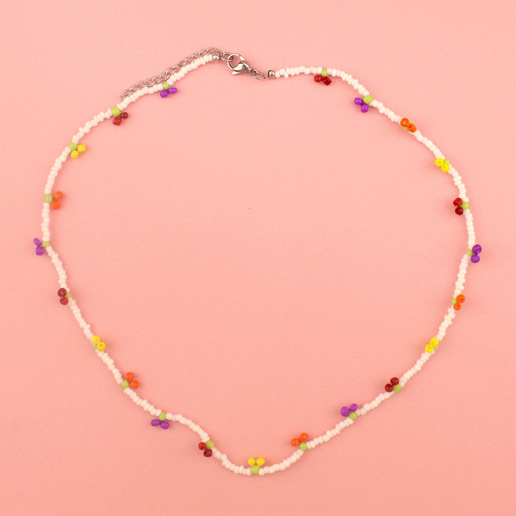 Glass seed beaded necklace with yellow, orange, red and purple berry charms 