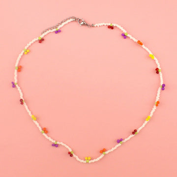 Glass seed beaded necklace with yellow, orange, red and purple berry charms 