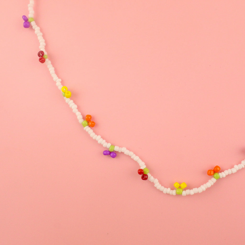 Glass seed beaded necklace with yellow, orange, red and purple berry charms 
