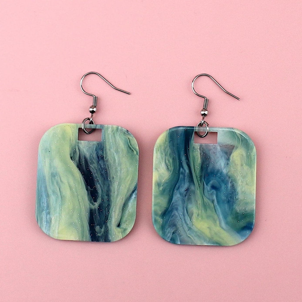 Blue sparkling glittery marble resin charms on stainless steel earwires