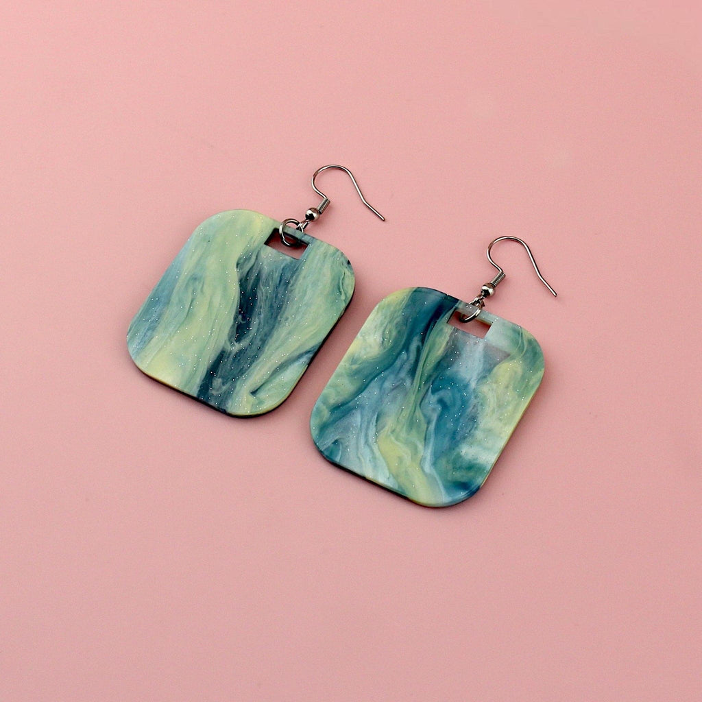 Blue sparkling glittery marble resin charms on stainless steel earwires