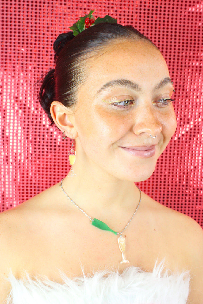 Model wearing a champagne glass earring with the matching necklace