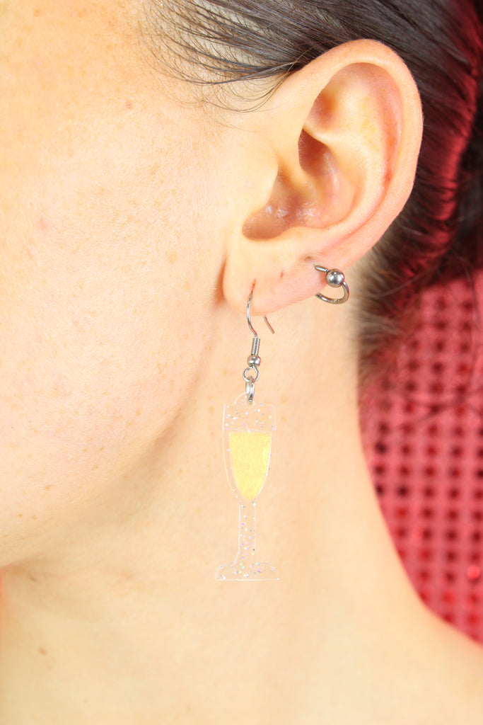 Model wearing the champagne glass earring