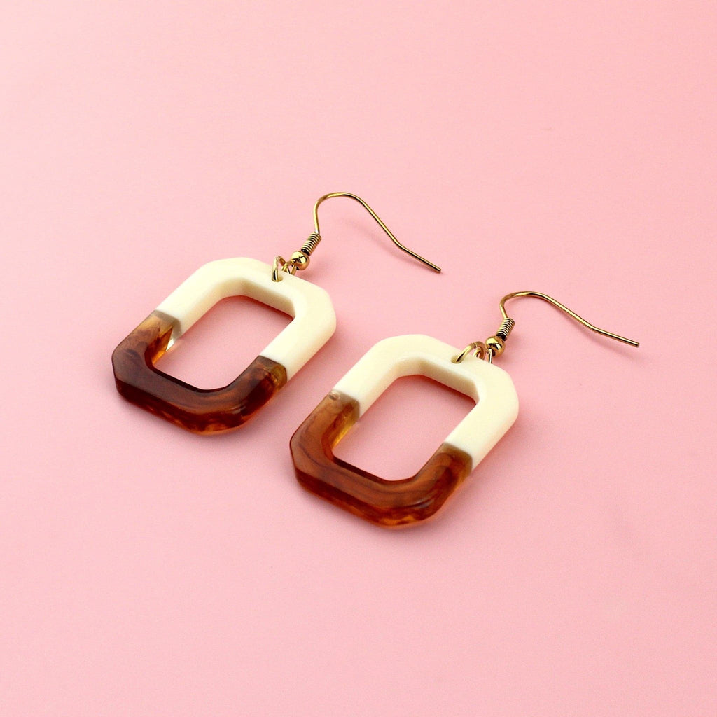 Half brown and half cream rectangle shaped earrings on gold plated stainless steel earwires