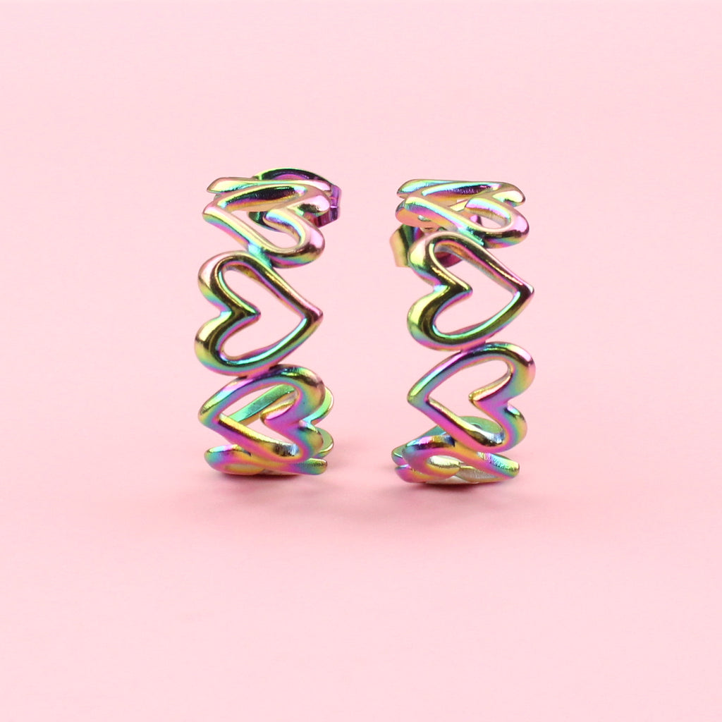 Hoop earrings made up of oil slick hearts on stainless steel studs