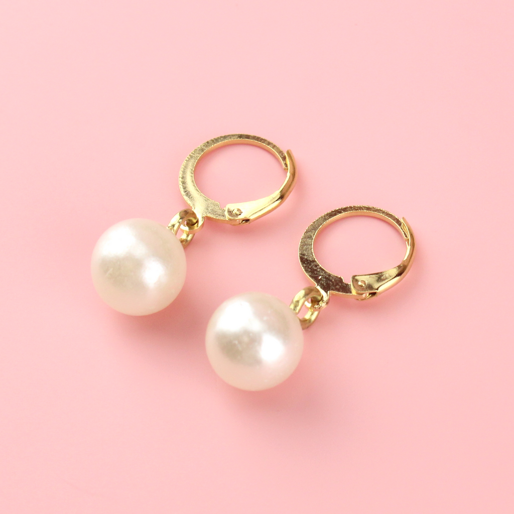 Gold plated stainless steel huggie hoops with faux pearl charm