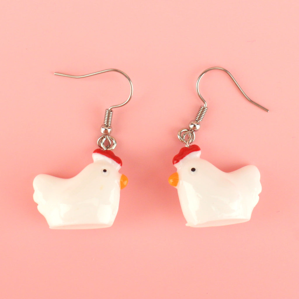 White resin chicken charms on stainless steel earwires